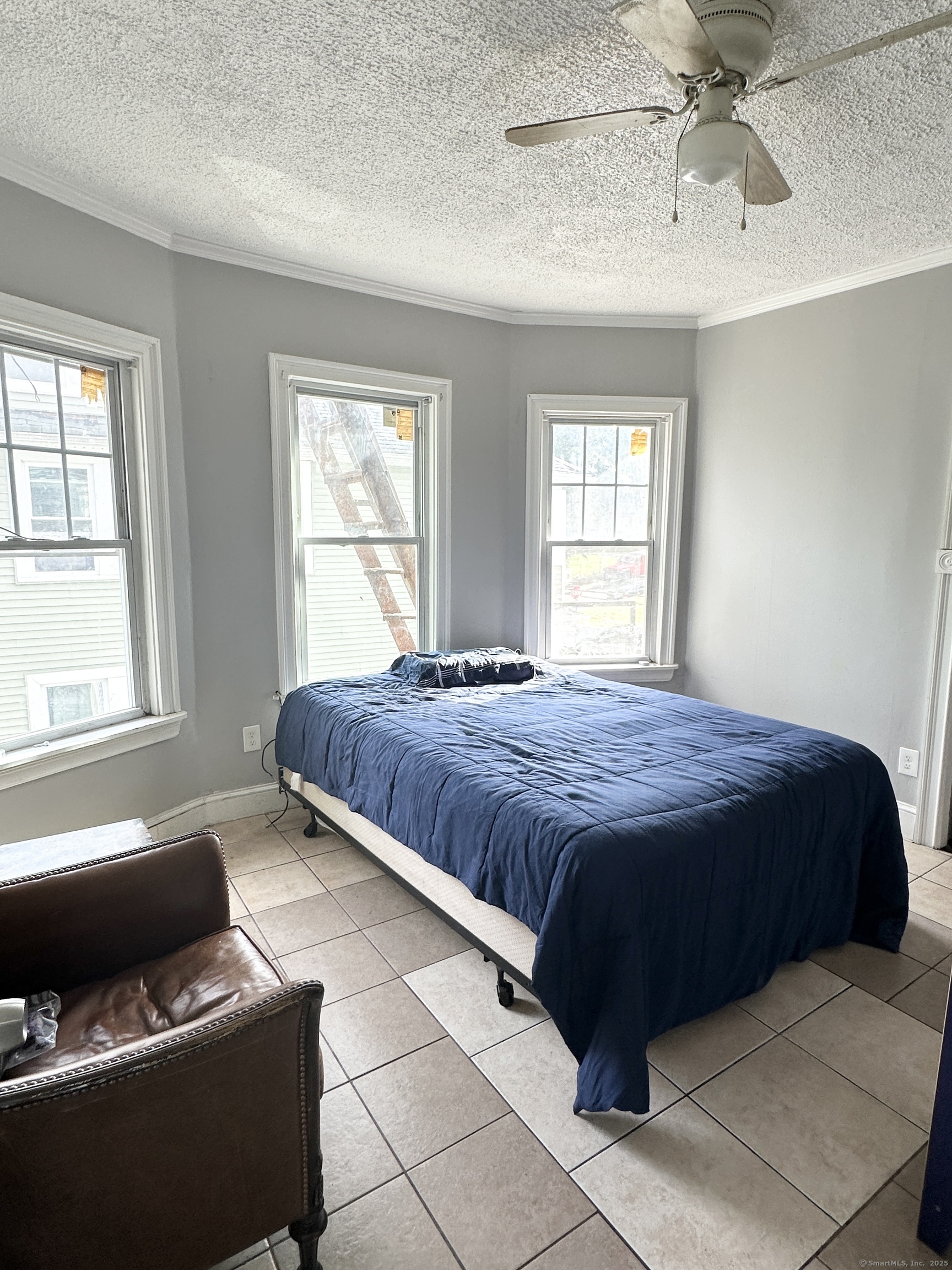 49 Prospect Street Meriden, CT 06451 - Photo 11 of 11 a spacious bedroom with a bed and window
