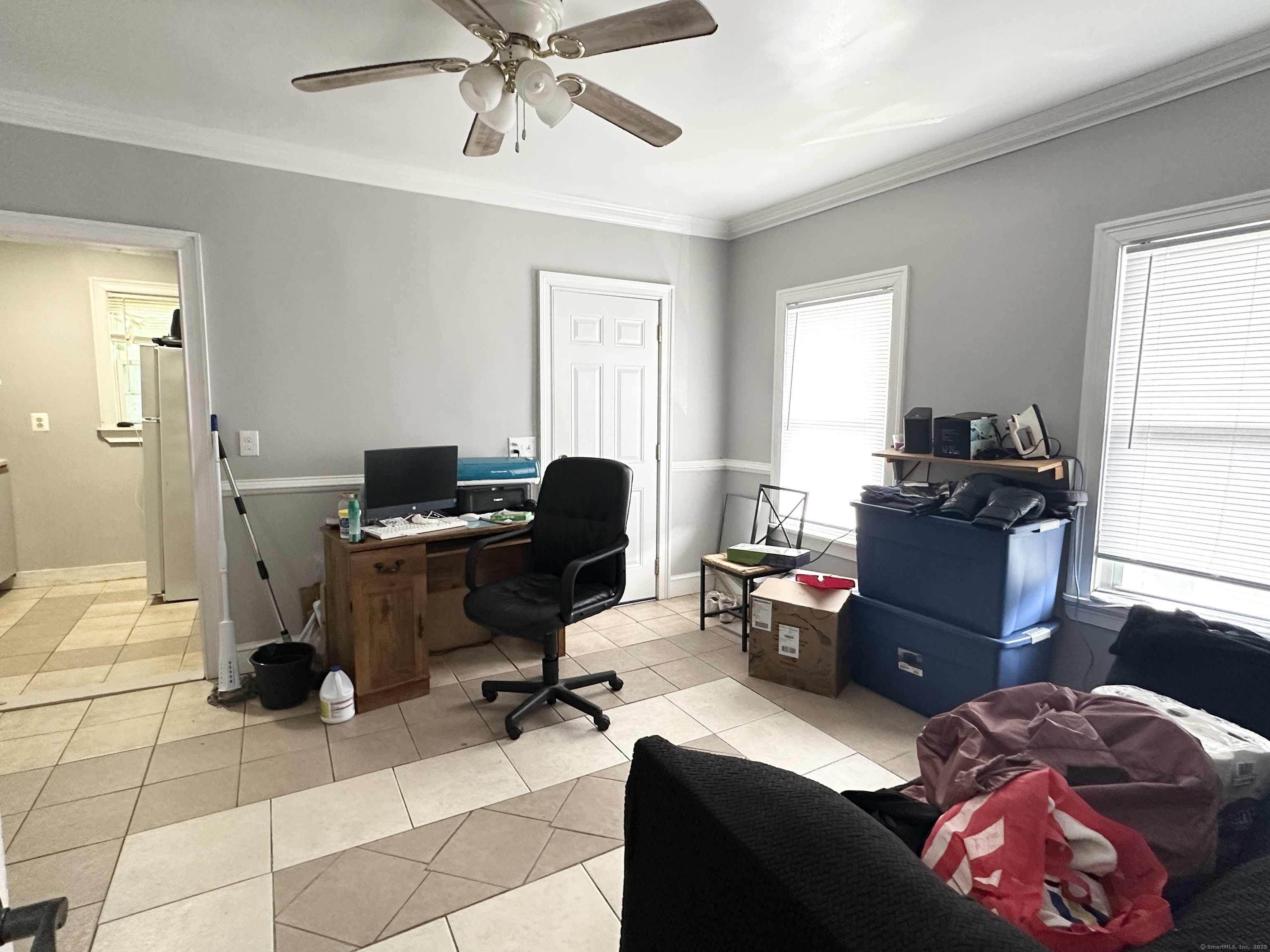 49 Prospect Street Meriden, CT 06451 - Photo 8 of 11 a view of a workspace with furniture and a window