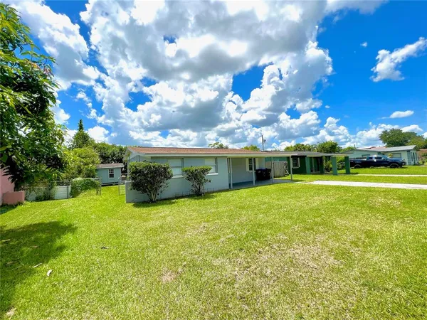 a view of a house with a big yard