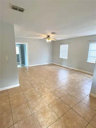 a view of an empty room with a window