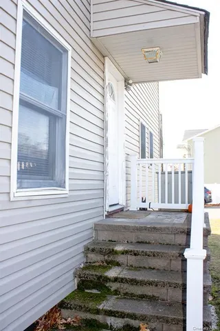 a view of a house with a small yard