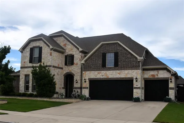 a front view of a house with yard