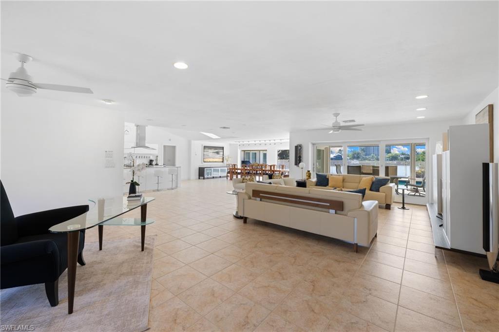 319 Pirates Bight Naples, FL 34103 - Photo 18 of 26 a living room with furniture and a table