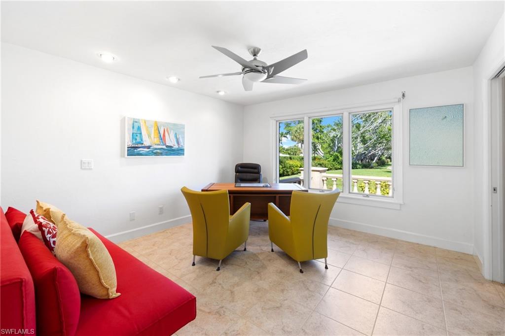 319 Pirates Bight Naples, FL 34103 - Photo 19 of 26 a living room with furniture and a window