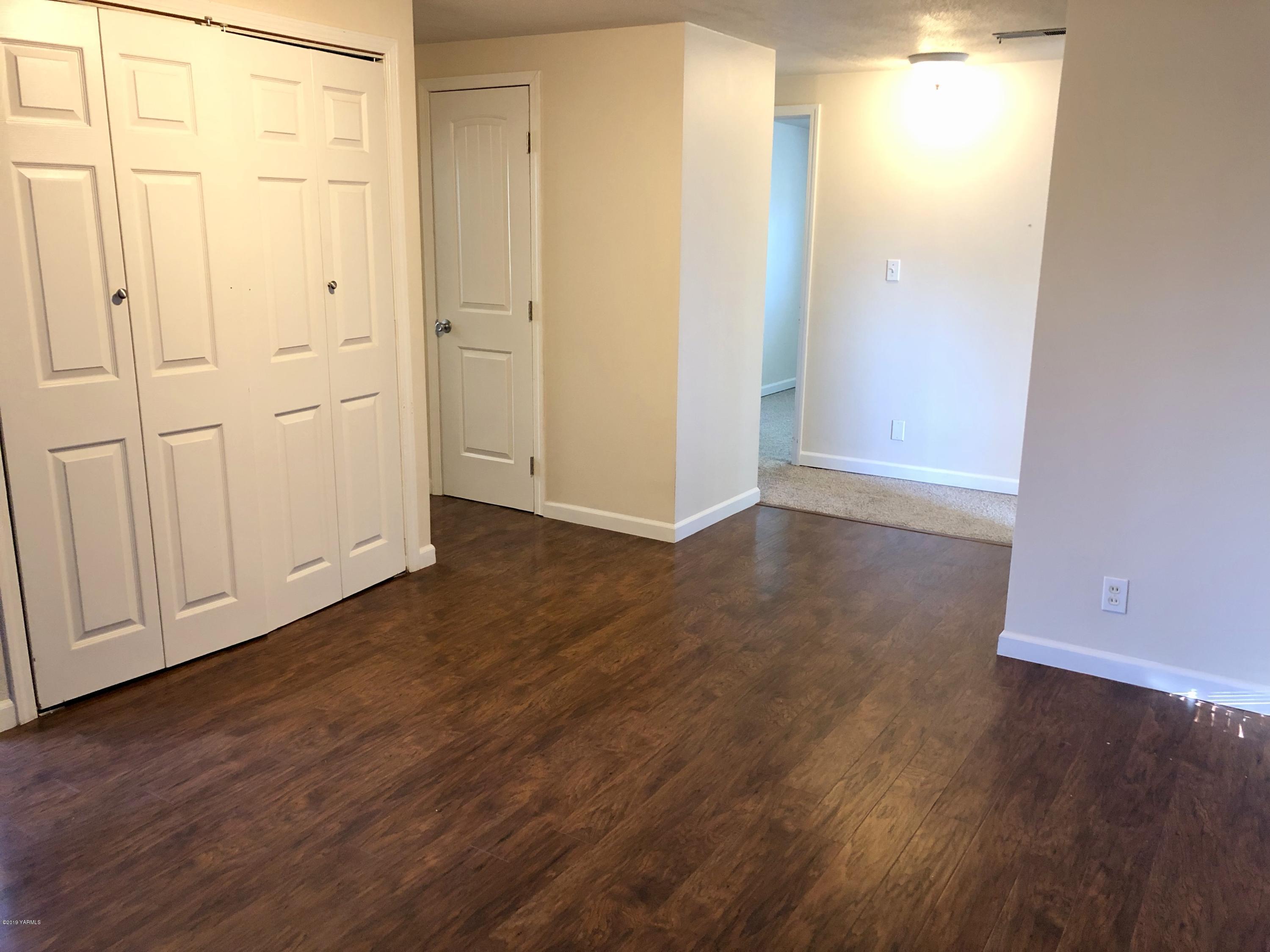 206 Hunziker Road Yakima, WA 98908 - Photo 10 of 28 a view of an empty room with wooden floor