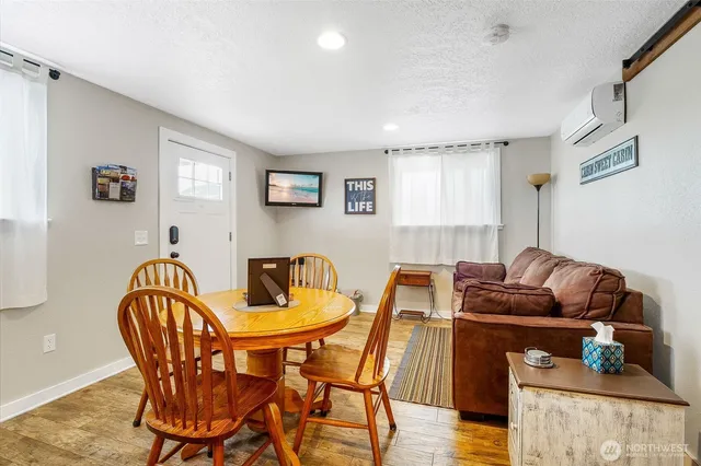 a bathroom with a toilet a sink a vanity and mirror