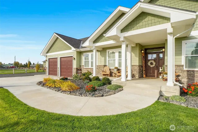 a front view of a house with garden