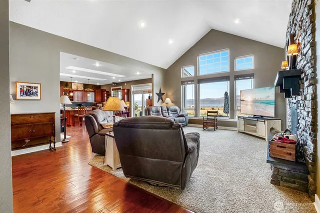 a living room with furniture window and wooden floor