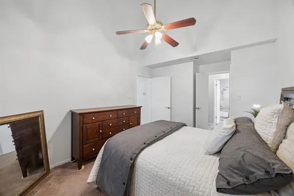 a bedroom with a bed and a television