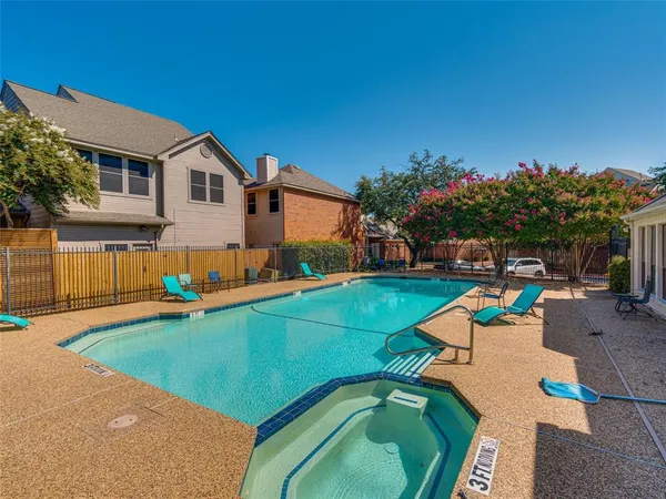 a view of a house with a backyard and a patio