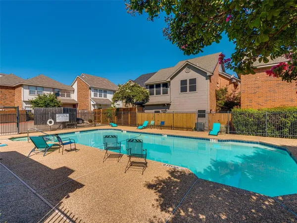 a house view with a sitting space and garden