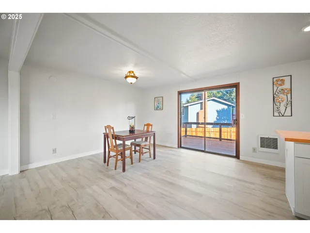 a view of a livingroom with furniture and wooden floor