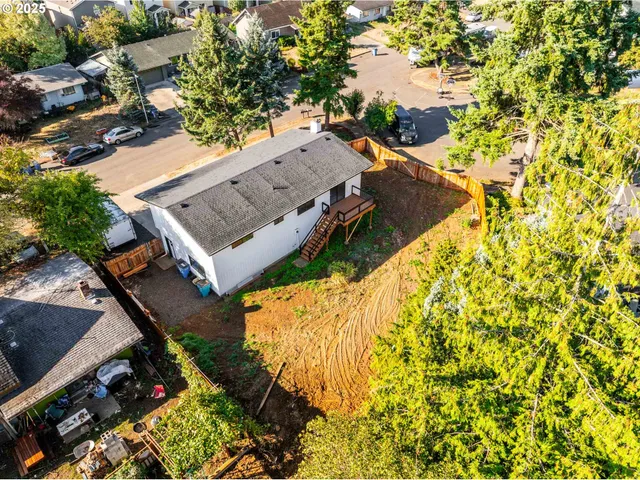 an aerial view of houses with yard