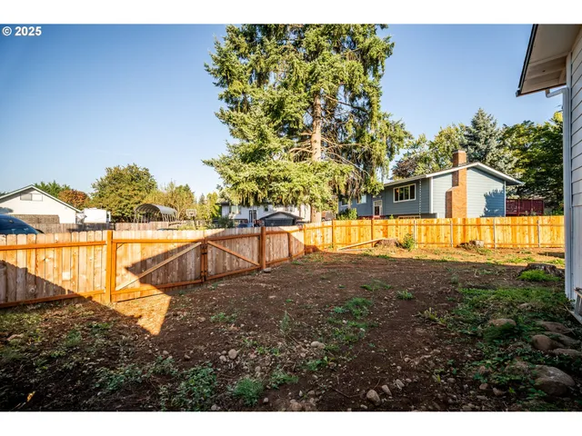 a view of a swimming pool with an outdoor seating and a yard