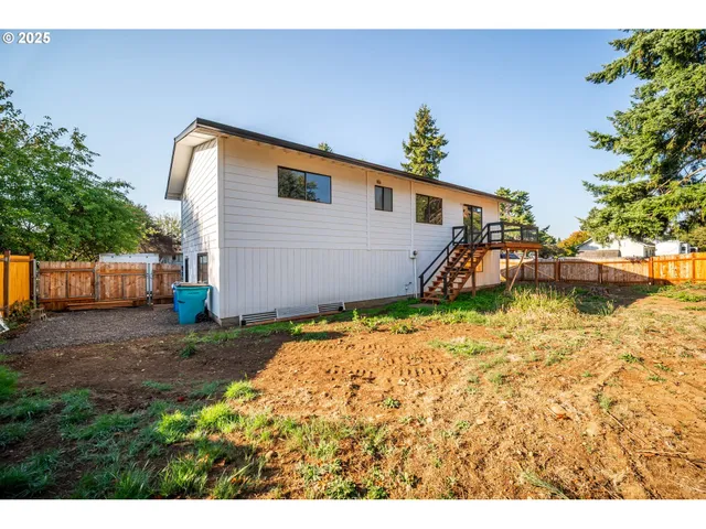 a house view with a backyard space