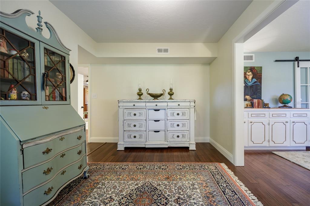 2006 Northwest 104th Way Gainesville, FL 32606 - Photo 13 of 71 a view of a bedroom with furniture and wooden floor