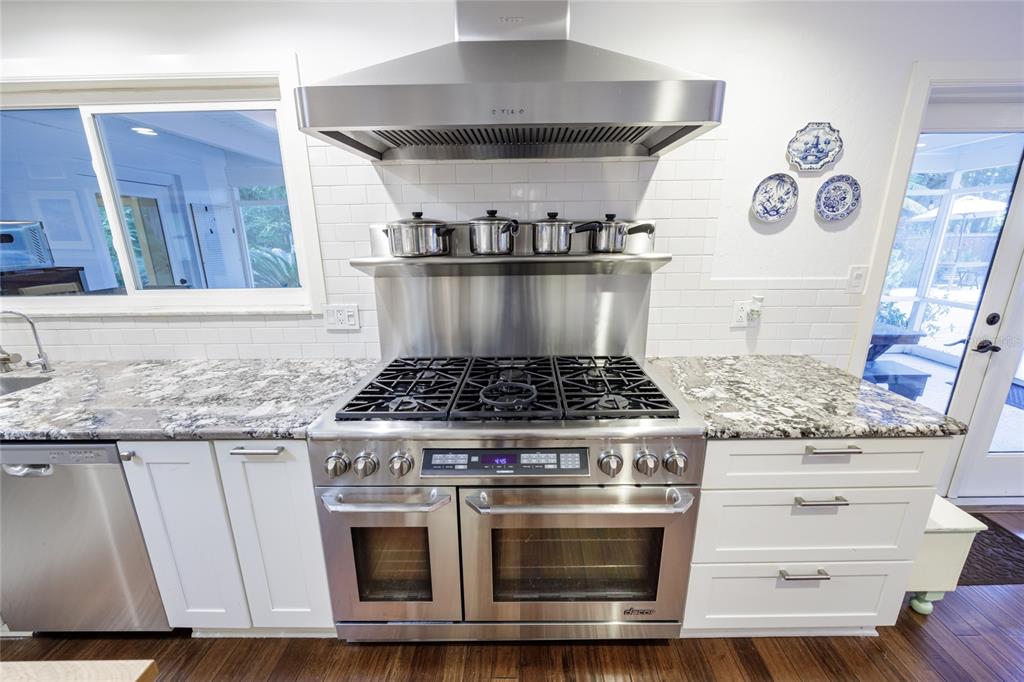 2006 Northwest 104th Way Gainesville, FL 32606 - Photo 24 of 71 a stove top oven sitting inside of a kitchen