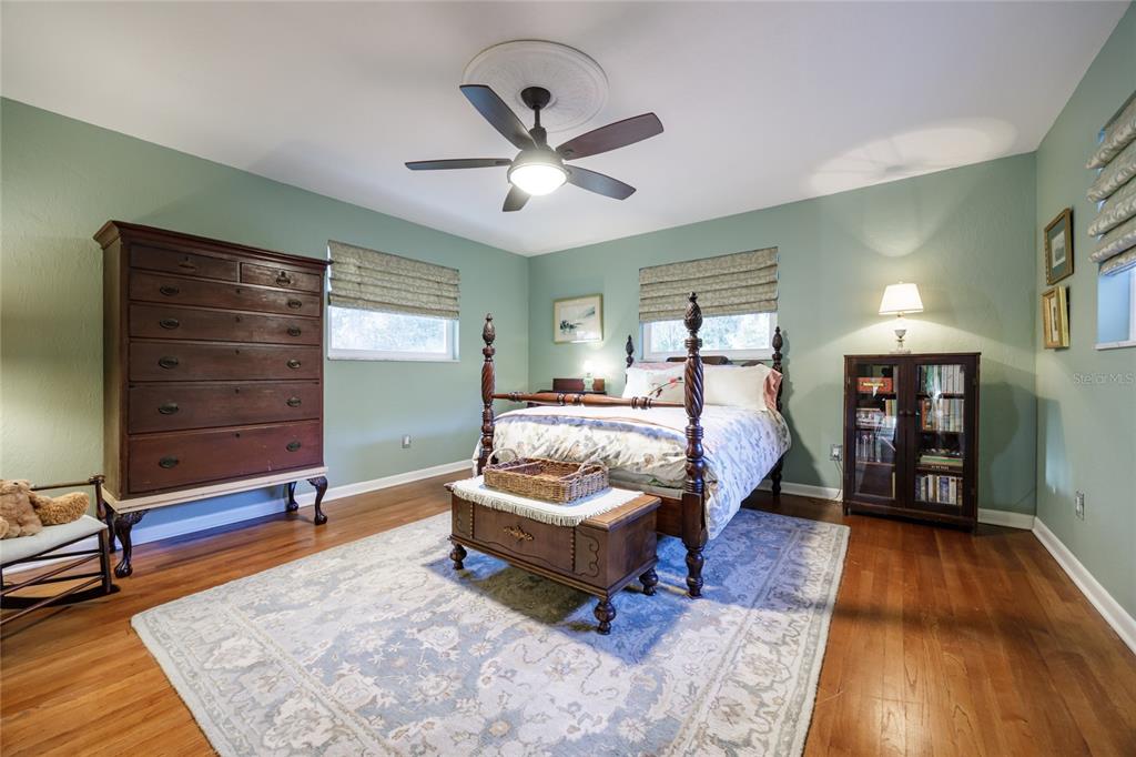2006 Northwest 104th Way Gainesville, FL 32606 - Photo 40 of 71 a spacious bedroom with a bed and a chandelier