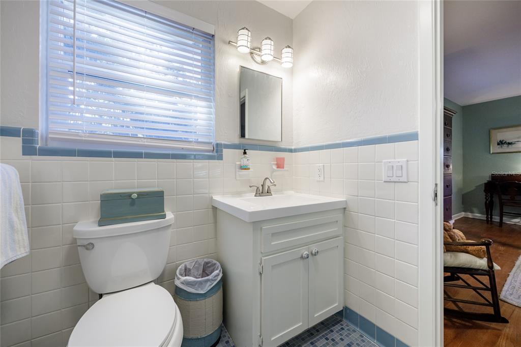 2006 Northwest 104th Way Gainesville, FL 32606 - Photo 42 of 71 a bathroom with a toilet sink and mirror