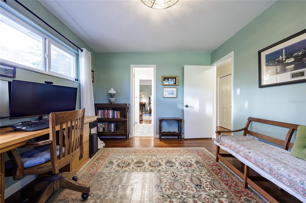 2006 Northwest 104th Way Gainesville, FL 32606 - Photo 45 of 71 a bedroom with furniture and a flat screen tv