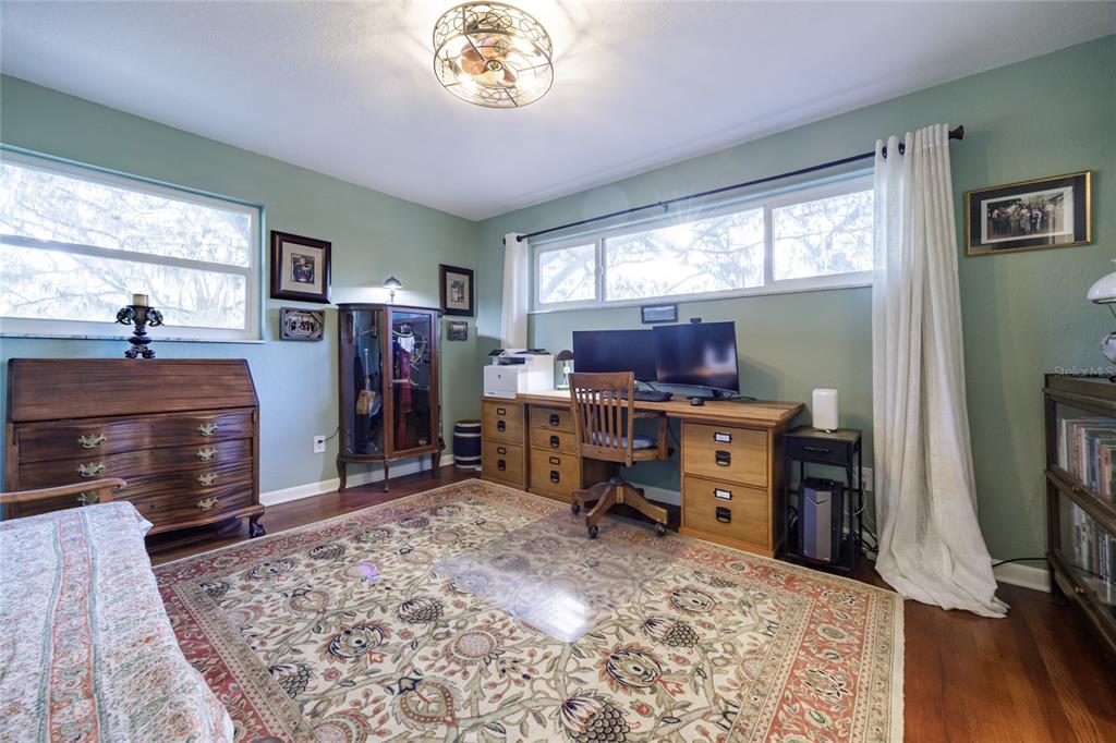 2006 Northwest 104th Way Gainesville, FL 32606 - Photo 46 of 71 a room with furniture and a flat screen tv