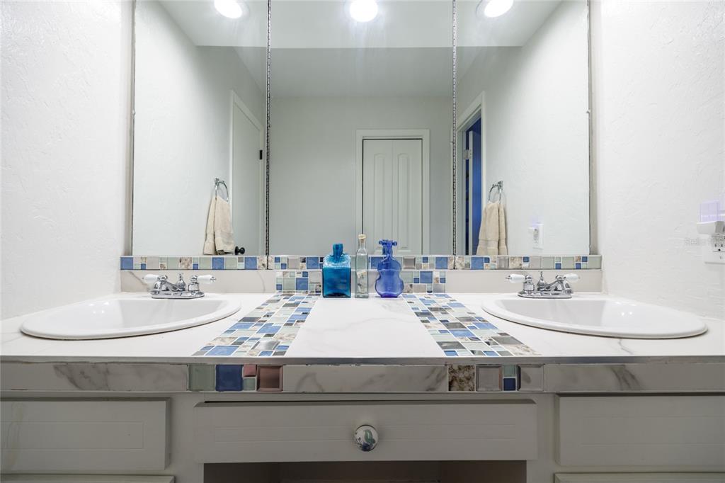 2006 Northwest 104th Way Gainesville, FL 32606 - Photo 54 of 71 a bathroom with a sink and a mirror