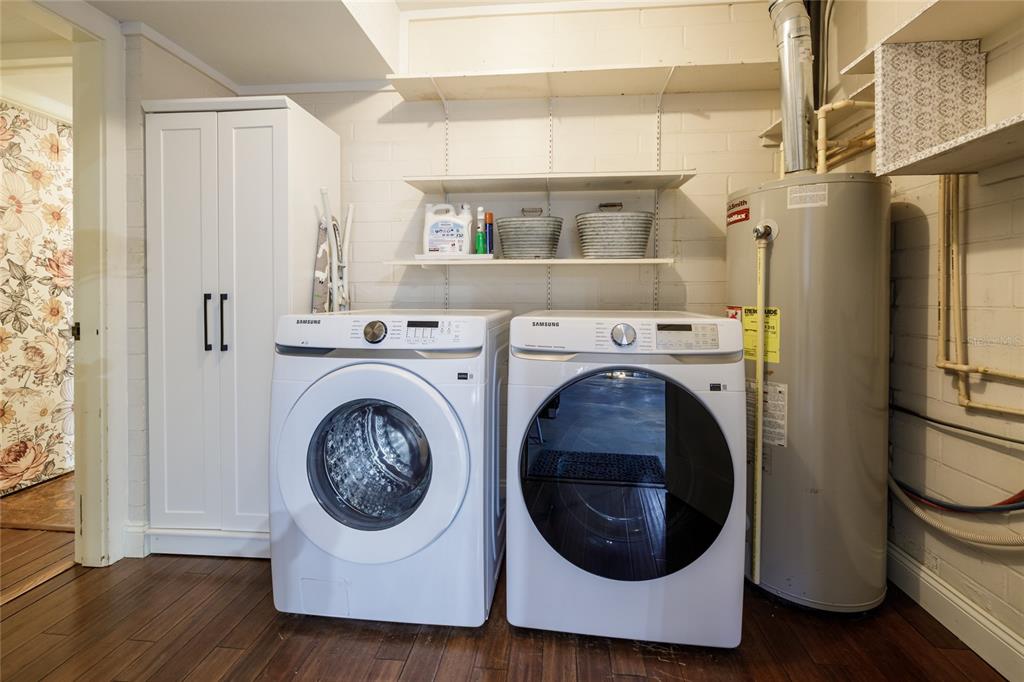 2006 Northwest 104th Way Gainesville, FL 32606 - Photo 58 of 71 a utility room with sink dryer and washer