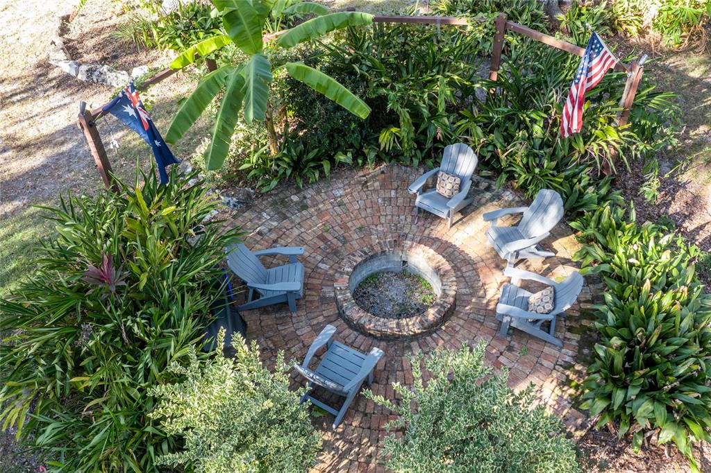 2006 Northwest 104th Way Gainesville, FL 32606 - Photo 68 of 71 a backyard of a house with lots of green space and a fountain