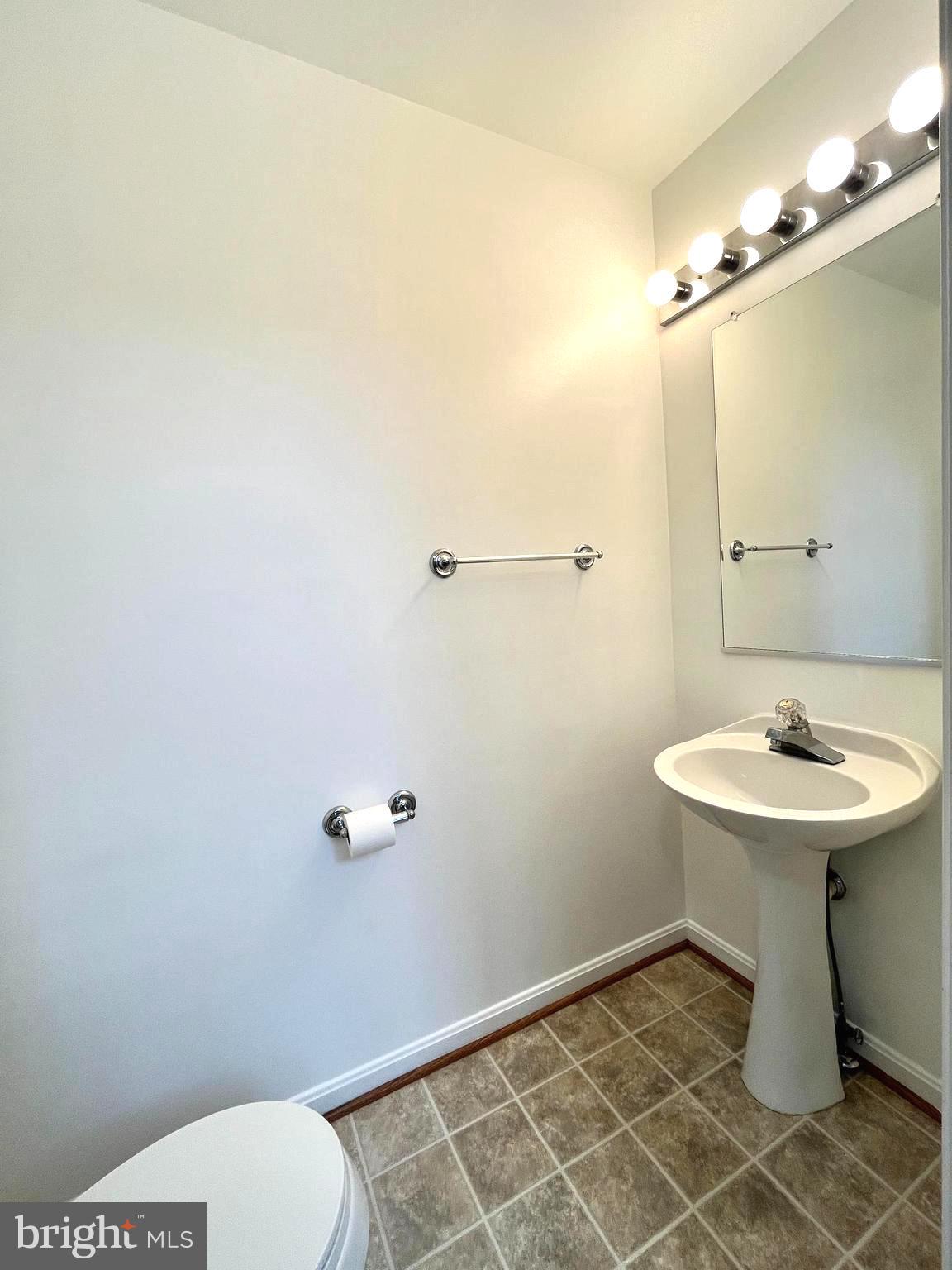 2034 Pinecroft Court Odenton, MD 21113 - Photo 11 of 31 a bathroom with a sink a toilet and a mirror