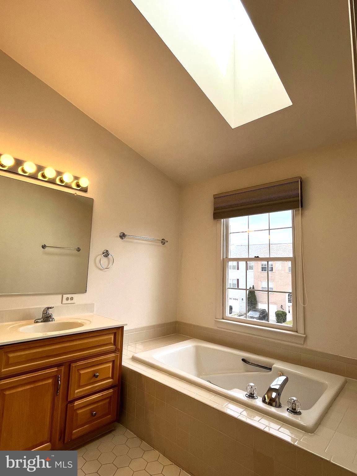 2034 Pinecroft Court Odenton, MD 21113 - Photo 13 of 31 a bathroom with a tub sink and mirror