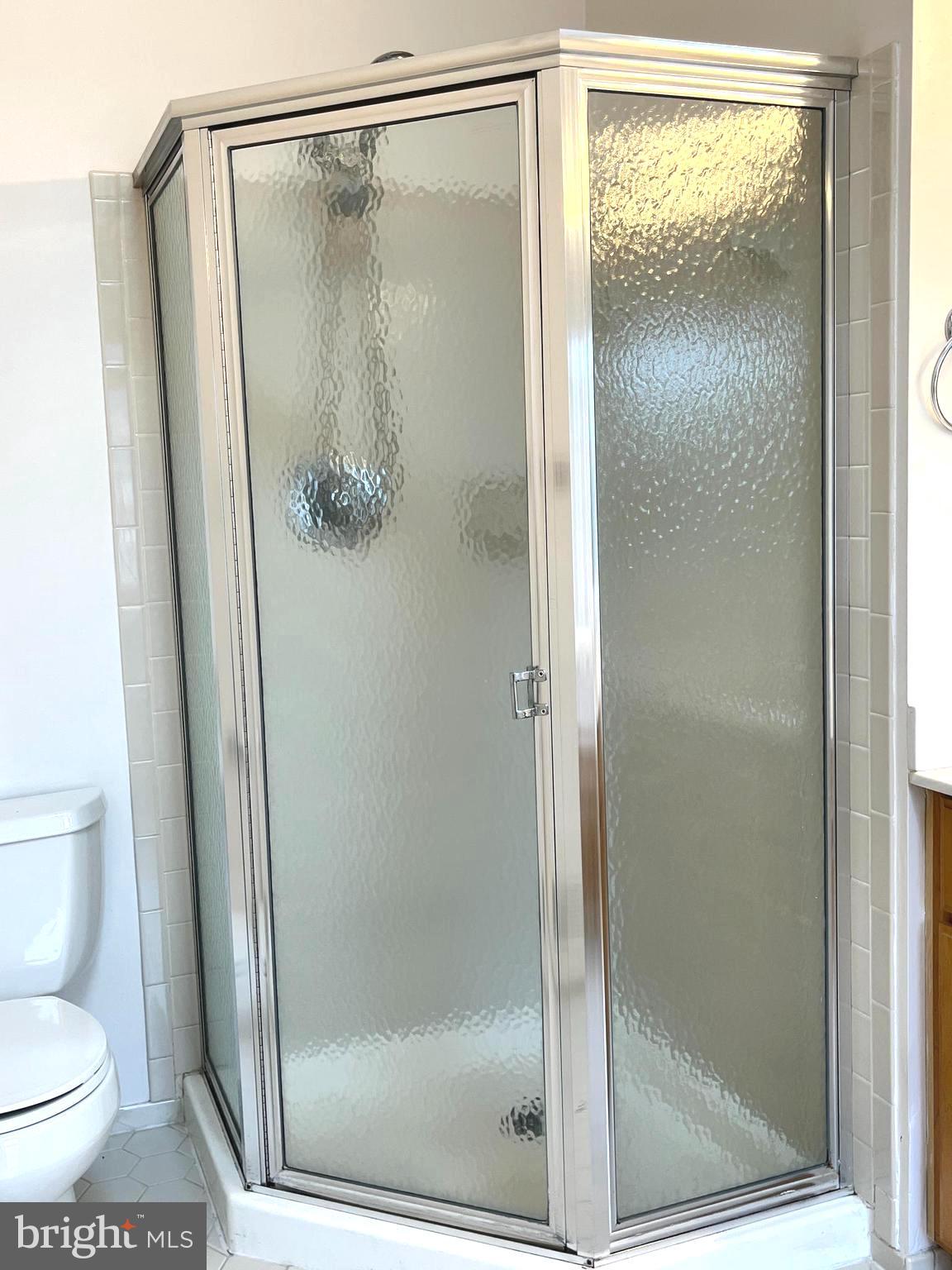 2034 Pinecroft Court Odenton, MD 21113 - Photo 15 of 31 a bathroom with a glass shower door