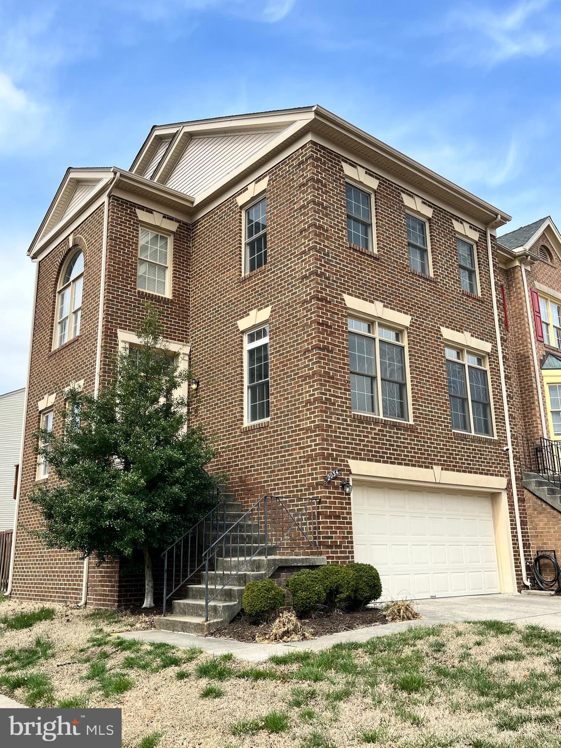 2034 Pinecroft Court Odenton, MD 21113 - Photo 2 of 31 a front view of a house with garden