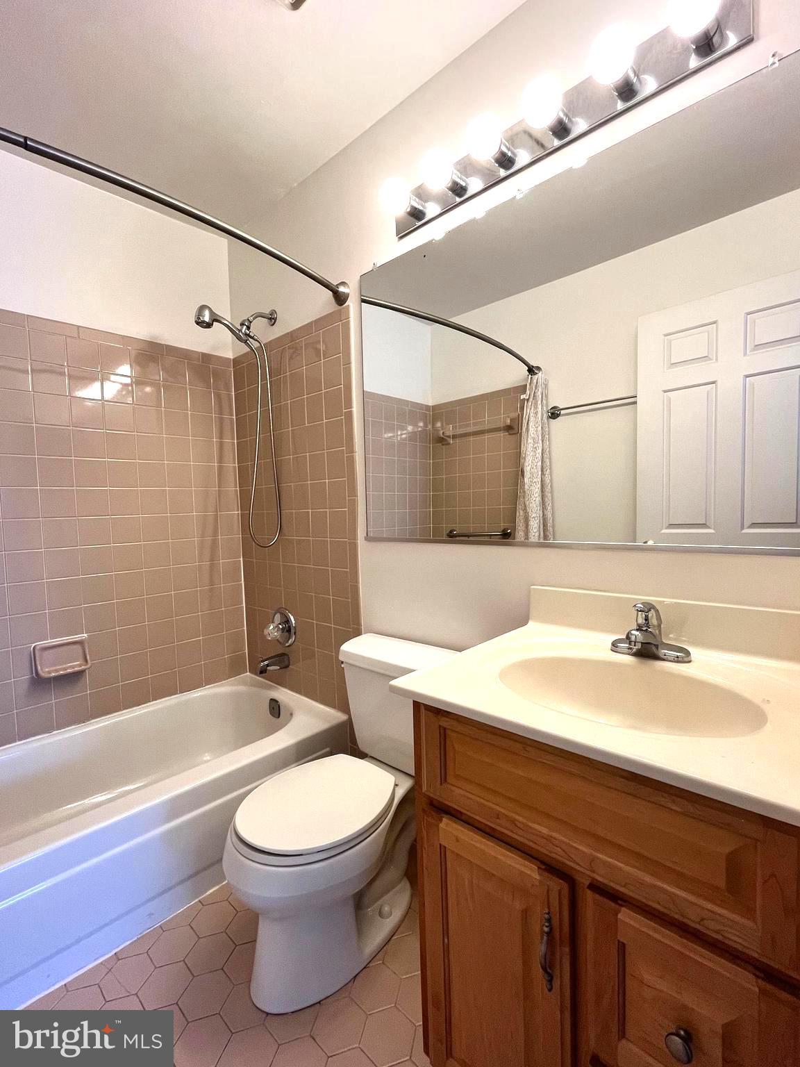 2034 Pinecroft Court Odenton, MD 21113 - Photo 21 of 31 a bathroom with a sink a toilet and shower