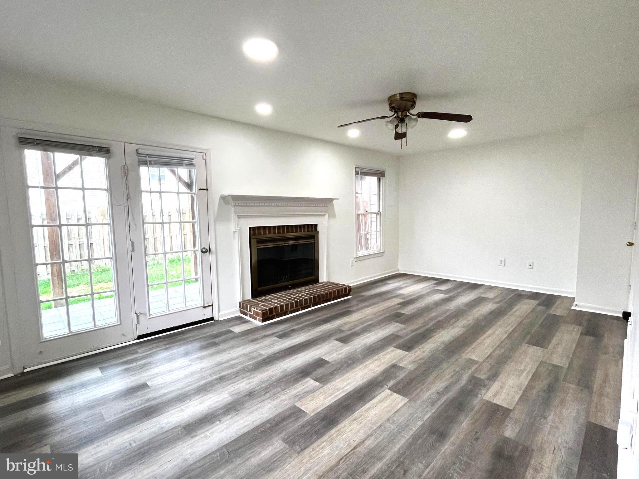 2034 Pinecroft Court Odenton, MD 21113 - Photo 22 of 31 an empty room with windows and fireplace
