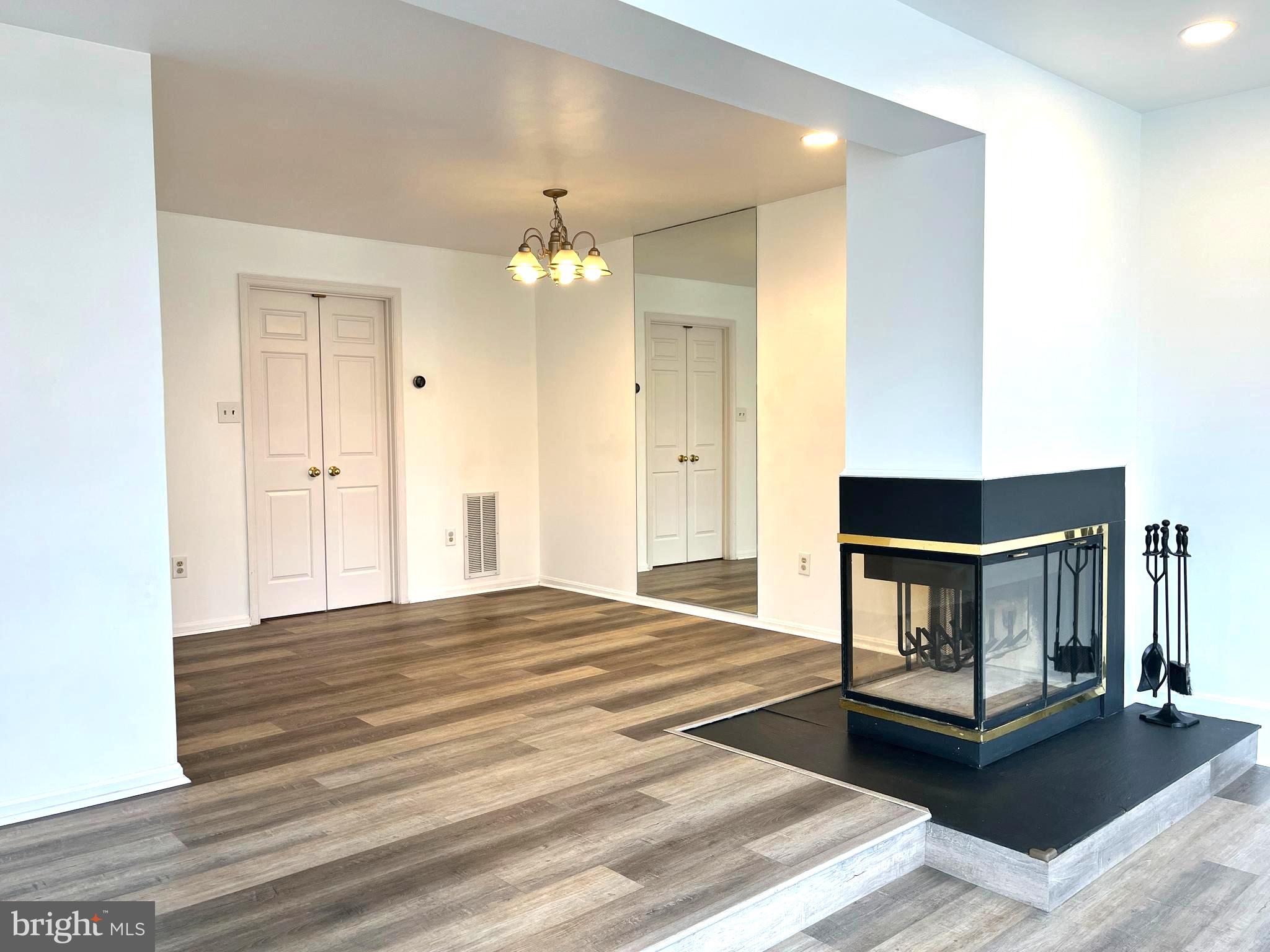 2034 Pinecroft Court Odenton, MD 21113 - Photo 6 of 31 a bedroom with a bed and a fireplace