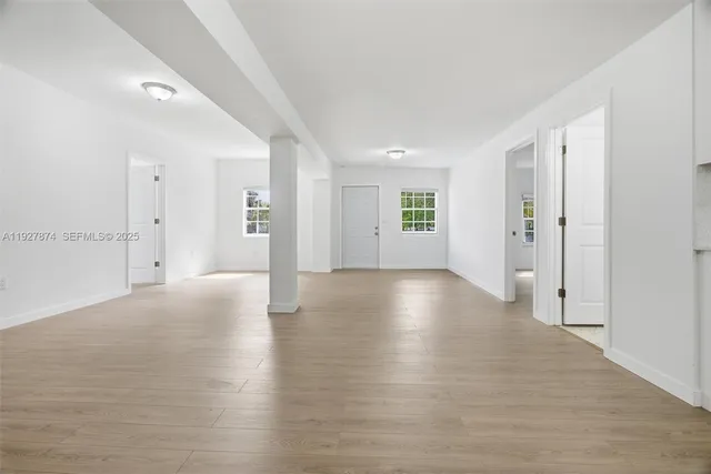 a view of a livingroom with wooden floor