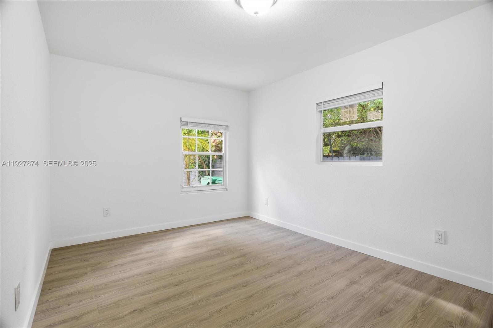 465 Northeast 165th Street, Unit 465 Miami, FL 33162 - Photo 10 of 15 an empty room with a window