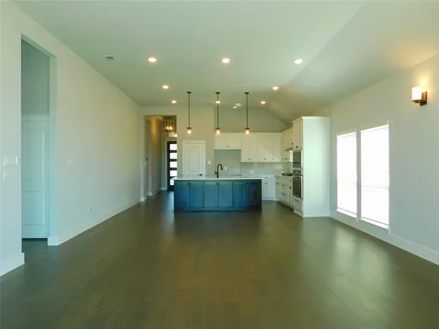 a view of a kitchen and kitchen with a sink cabinets