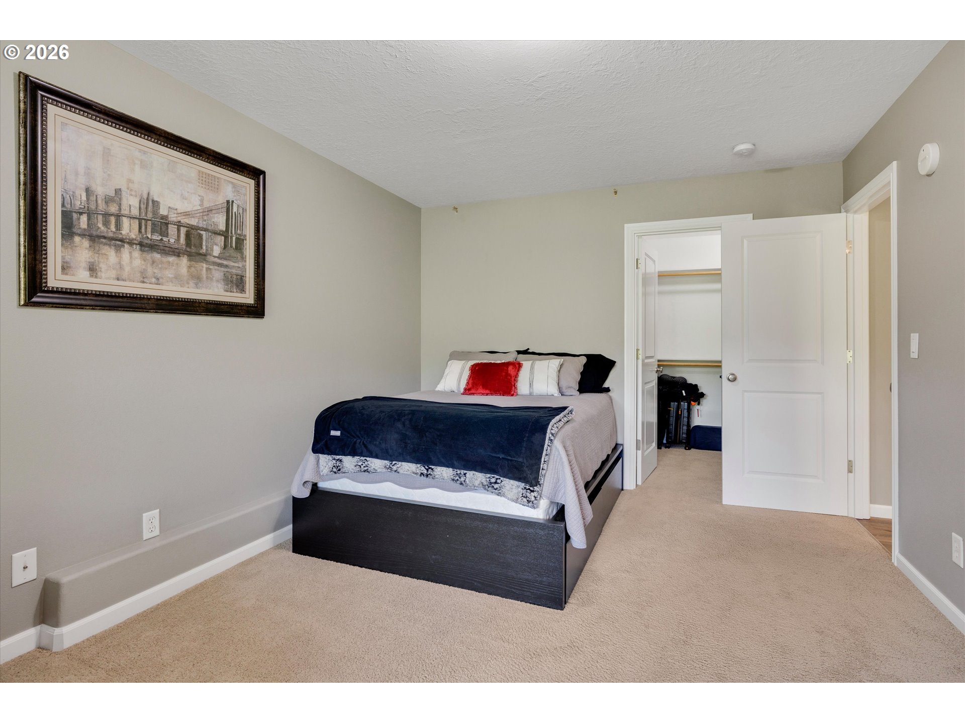 3769 10th Street Hubbard, OR 97032 - Photo 29 of 47 a bedroom with a bed and a painting on the wall