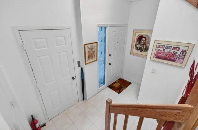 a view of a hallway with paintings on the wall