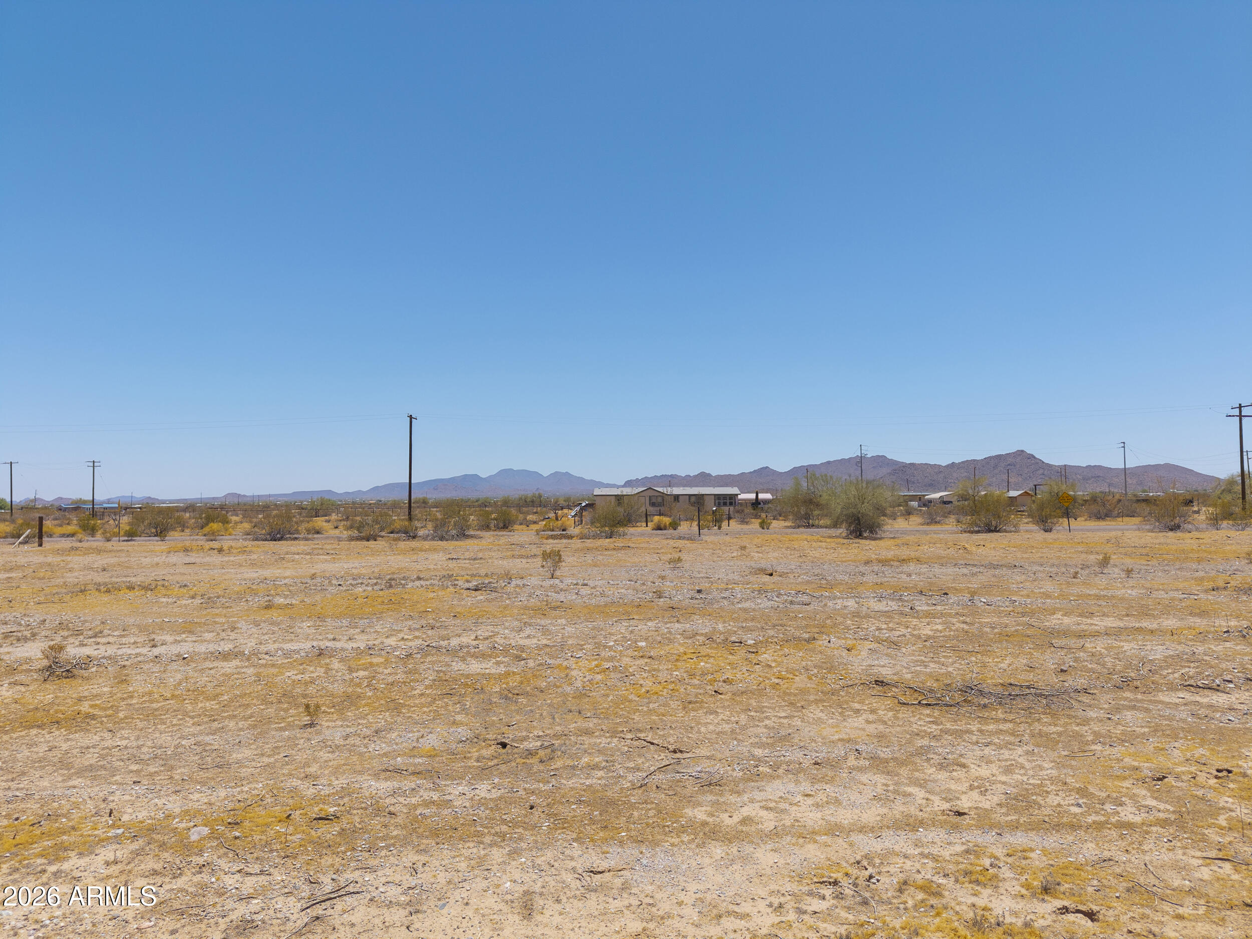 54650 West Ivory Road, Unit 57 Maricopa, AZ 85139 - Photo 16 of 17 a view of an ocean with a mountain