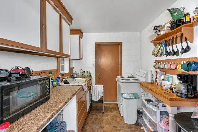 a kitchen with a stove and a sink