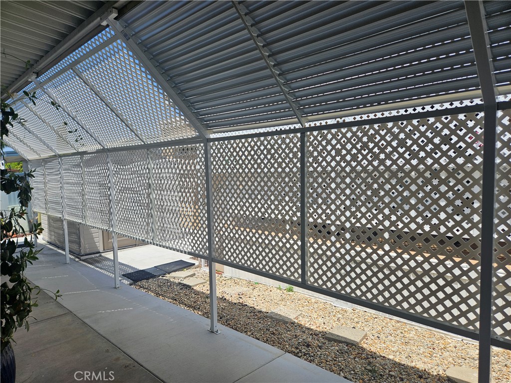 14851 Jeffrey Road, Unit 171 Irvine, CA 92618 - Photo 36 of 49 Extended carport with privacy screens