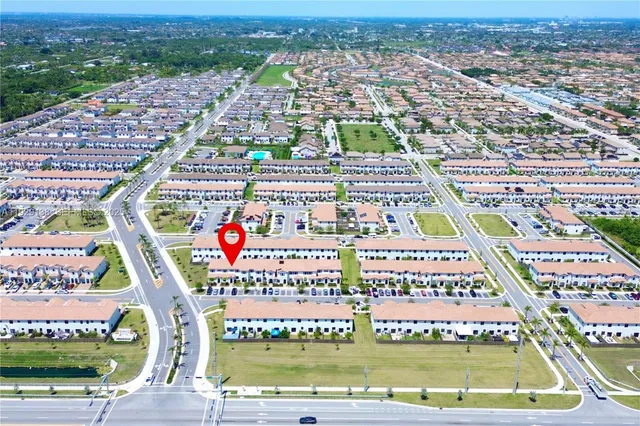 a view of a patio with couches table and chairs with potted plants