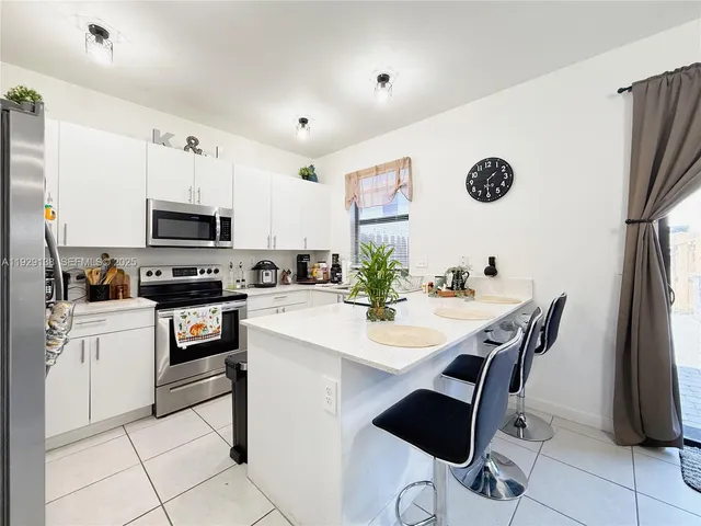 a view of a patio with a table and chairs