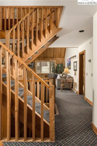 a living room with furniture a rug and a fireplace