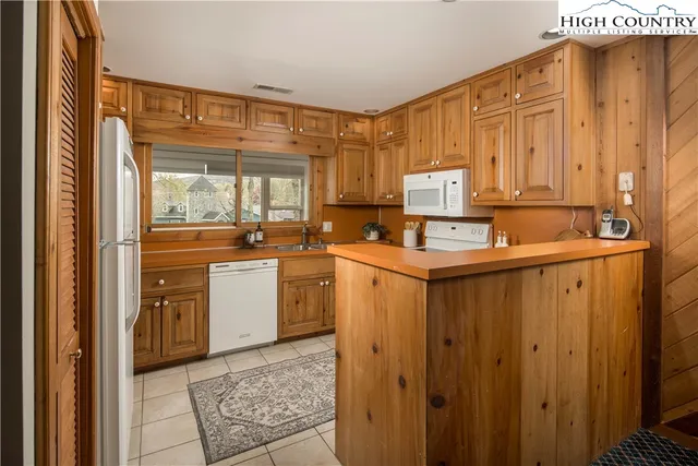 a dining room with furniture window and outside view