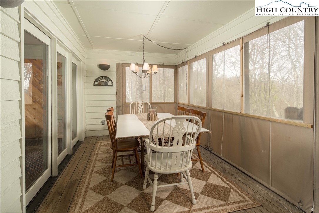 109 Old Field Road Beech Mountain, NC 28604 - Photo 21 of 50 a dining room with furniture window and outside view