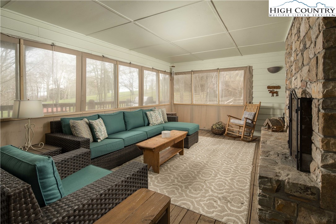 109 Old Field Road Beech Mountain, NC 28604 - Photo 22 of 50 a living room with furniture and a fireplace