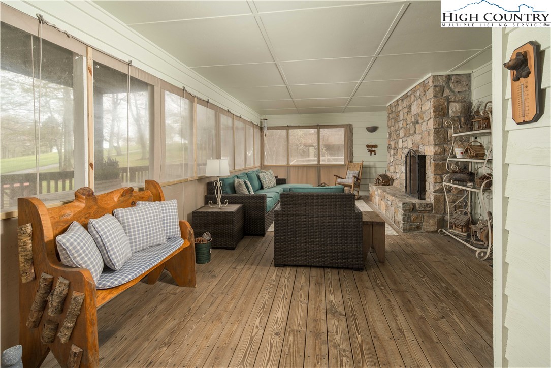 109 Old Field Road Beech Mountain, NC 28604 - Photo 23 of 50 a living room with furniture and a fireplace